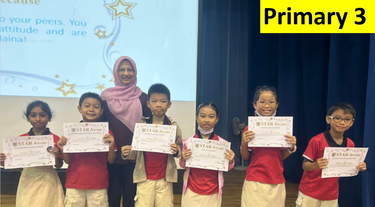 Six Primary 3 students hold Star Award certificates while standing with a teacher on a stage.
